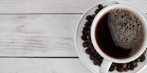 Coffee on white wooden textured background, banner concept