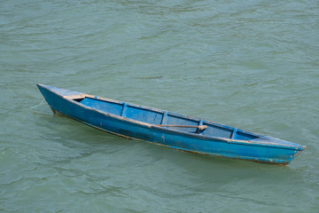 Blue sampan at sea,  nobody.