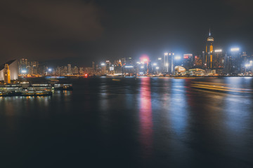 Fototapeta na wymiar Hong Kong cityscape at night. View From Victoria Harbour