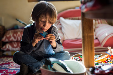 6 year old boy playing in his room