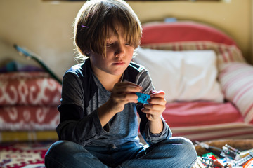 6 year old boy playing in his room