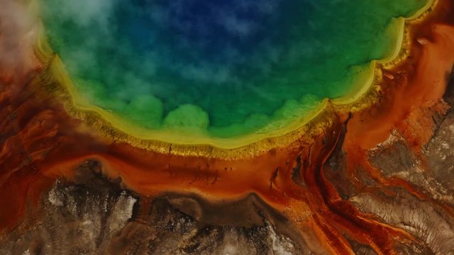 Midway Geysers basin in Yellowstone National Park, aerial view of Yellowstone lands, impressive nature shoots, steaming geysers.