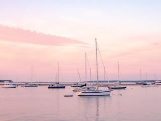 Fototapeta na wymiar Sailboats in marina at sunset