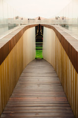 wooden tunnel walkway with white sky in down