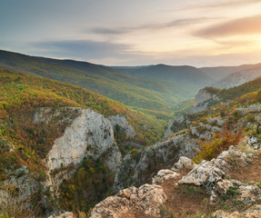 Autumn sunset in mountain canyon.