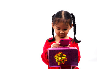 Cute asian baby girl playing smartphone and keeping giftbox on white backgrounds