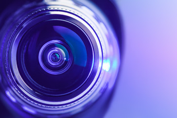 Close-up camera lens with purple backlight. Optics. Gorizontal photo