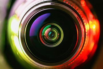 Close-up camera lens with yellow and red backlight. Optics. Gorizontal photo