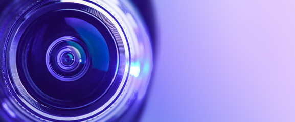 Banner. Close-up camera lens with purple backlight. Optics.