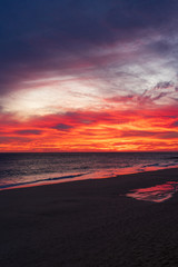 Fototapeta na wymiar A blood red sunset on the coast of Canary Island Fuerteventura
