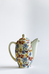 Colorful teapot on a white background
