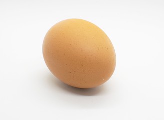 Brown egg isolated on white background.