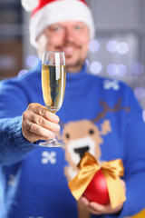 Bearded smiling man wearing warm blue sweater