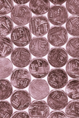 Arrays of Thai money,  one Baht coins in rose gold color