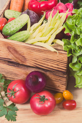 Fresh vegetables in wooden box as food containing vitamins. Healthy lifestyles and nutrition