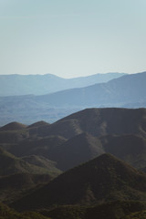 Obraz premium Colorful mountains far away with a clean and blue sky