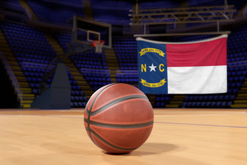 North Carolina state flag and basketball on Court Floor