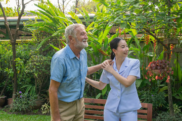 Young nurse take care senior man at home, Senior man happniess and smiling with nurse, Health care concept