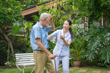 Young nurse take care senior man at home, Senior man happniess and smiling with nurse, Health care concept