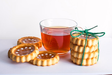 Cup of tea with beautiful cookies Packed as gift on white background