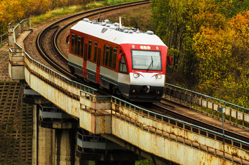 Naklejka premium Train on a Bridge Autumn