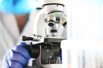 Fototapeta na wymiar Head microscope on the background laboratory is a study human biology analyzes for non-compliance with the requirements organization public health at international level