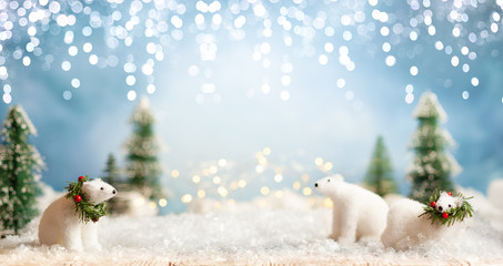 Beautiful winter background with white bears, fir trees and blue sky. Winter, New Year and Christmas concept with snowy background.