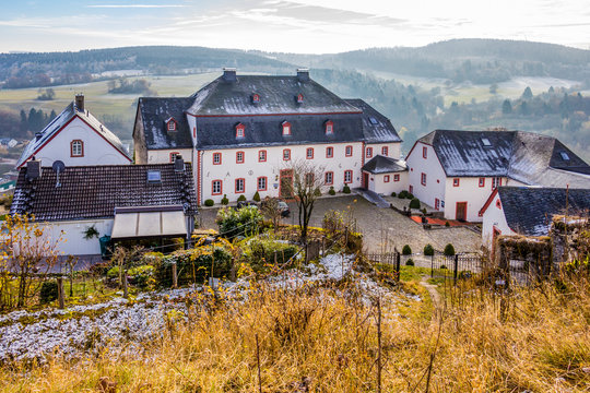 Picturesque elevated November view of the 18th-century former Amtshaus in Kronenburg, North Rhine-Westphalia, Germany