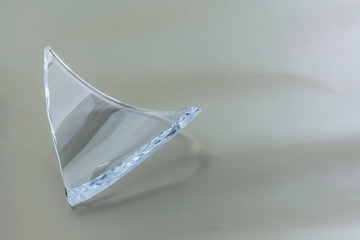 Broken glass dish on white background. Part of home decoration that was damaged during washing.