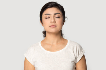 Calm indian girl meditate breathing fresh air