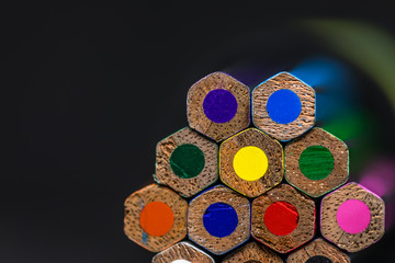 stacked bunch of clour pencils