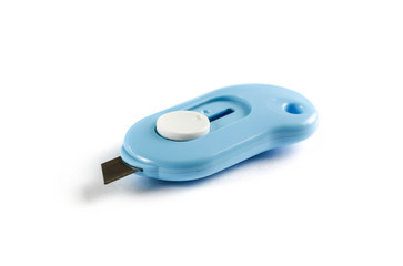 A small stationery knife. Close up. Isolated on white background