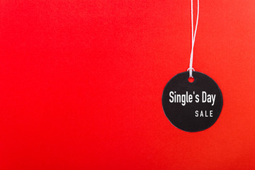 Online shopping Single's day sale text on Circle Black tag label on red background