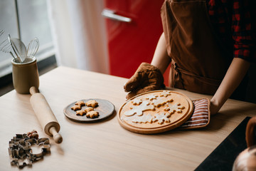 Christmas home bakery. Confectioner with gingerbread dough. Christmas and New Year celebration traditional treats. People cooking food