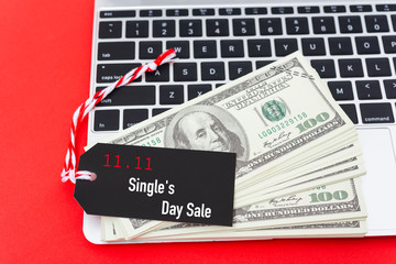 11.11 Online shopping Single's day sale text on Black tag label on laptop computer