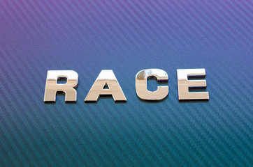 Obraz premium Concept of sport, speed, racing. Letters on carbon fiber background placed diagonally
