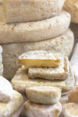 Appetizing slices of farm craft cheese on the boards