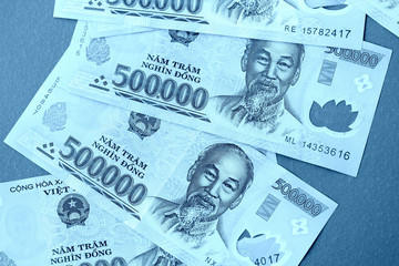 Five hundred thousand vietnamese dongs close up. Money background blue color toned