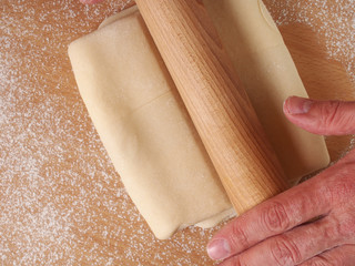 Rolling dough. Making Puff Pastry Series.