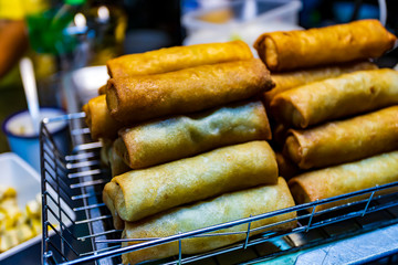 Hand made spring rolls on a food cart in Bangkok