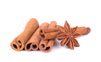 Obraz na płótnie Canvas Spicy Cinnamon Sticks and Anise isolated on White background closeup macro shot