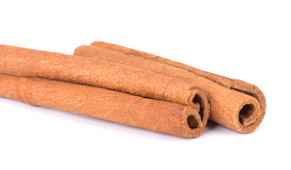 Cinnamon Sticks Stacked isolated on White background closeup macro shot