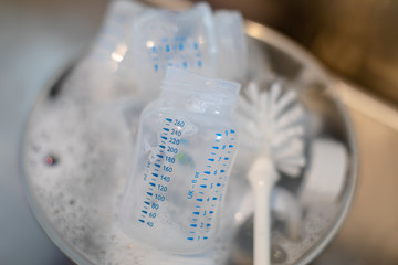 Washing baby bottles and nipples with soft bottle brush