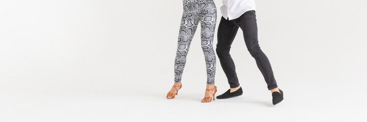 Social dance, bachata, kizomba, zouk, tango concept - Close-up of man's and woman's legs while...