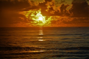 Beautiful Sunrise amidst the clouds over sea