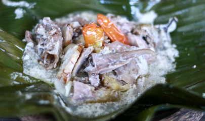 Chicken Garang Asem on banana leaves. Dominated by sour and spicy flavor.