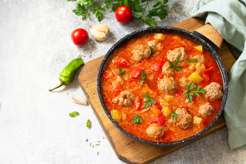 Spanish and Mexican food - Albondigas. Hot stew tomato soup with meatballs and vegetables. Free...
