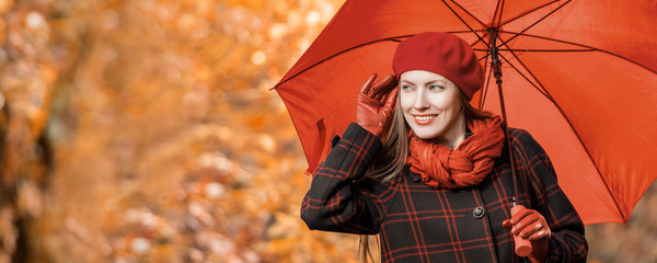 Beautiful woman portrait in autumn garden, park  in bright outfit, toned image