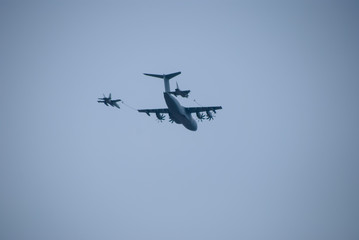 two fighter jets refueling in flight from a nurse plane or tank plane