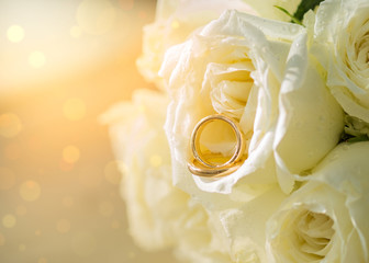 Set of wedding ring in rose bouquet flowers  background